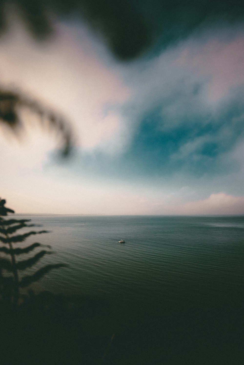 large body of water under clear blue sky