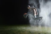 A dynamic shot of an athlete mid-movement, showcasing power and endurance.