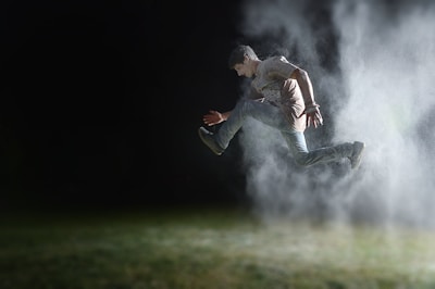 A dynamic sports action shot capturing an athlete in mid-air during a competition.