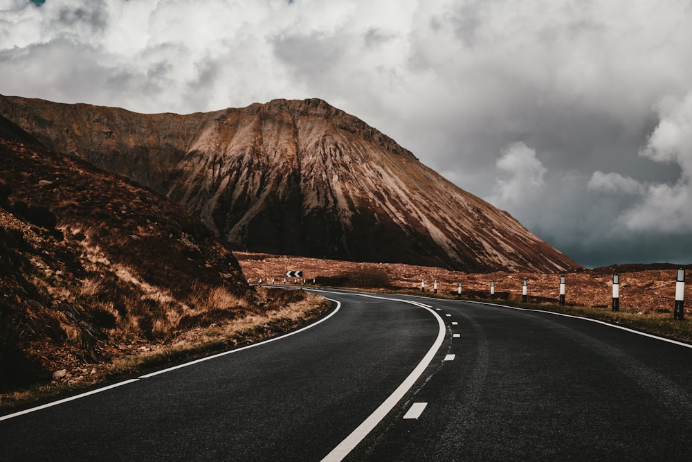 asphalt road near mountain