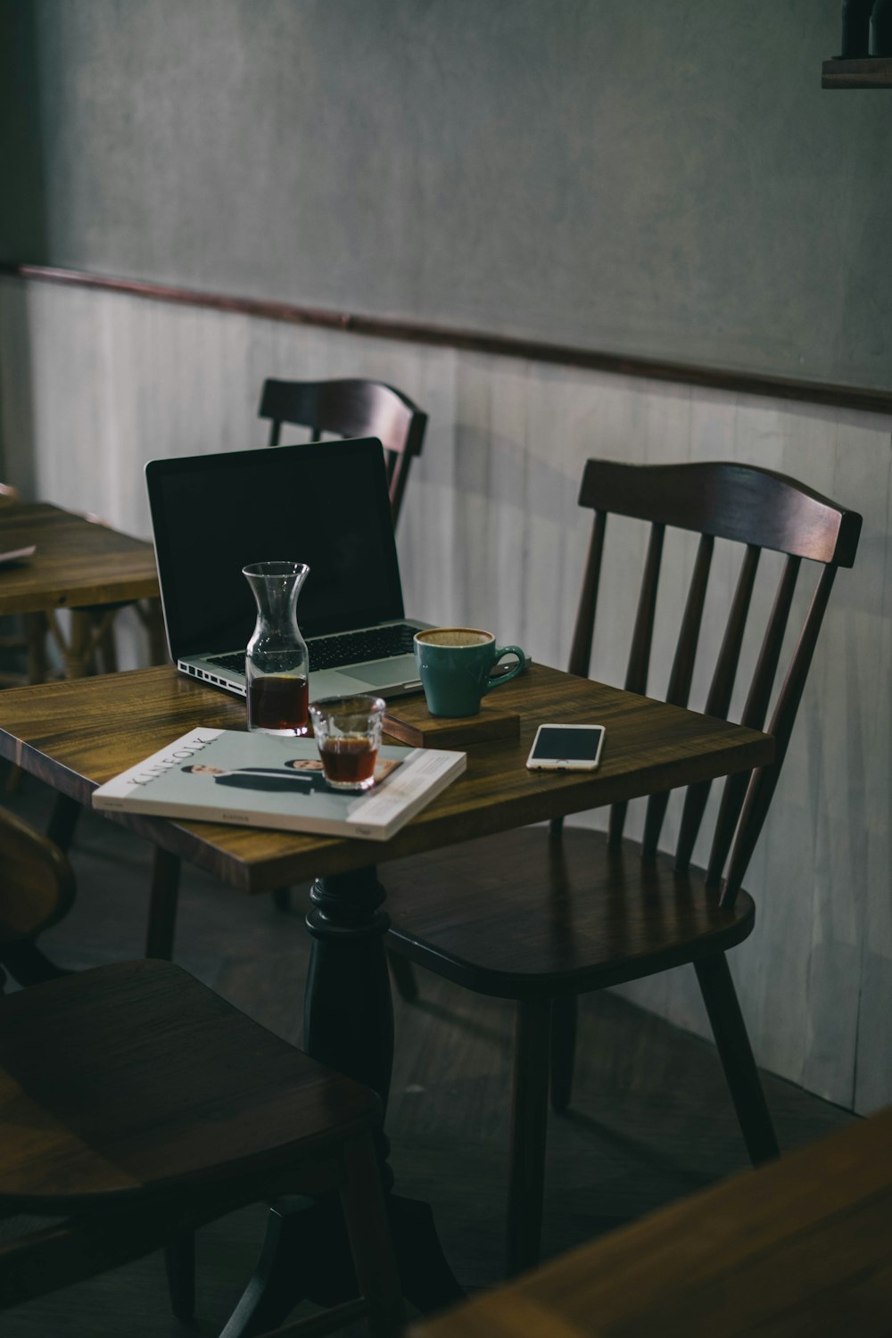 teal ceramic mug on brown wooden table