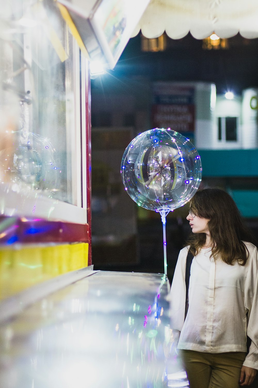 woman standing near crystal decor