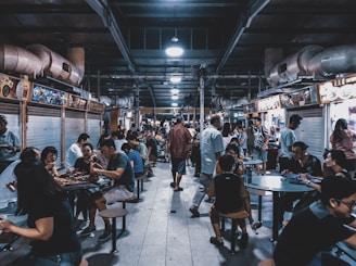 group of people sitting in front of tables
