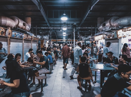 group of people sitting in front of tables