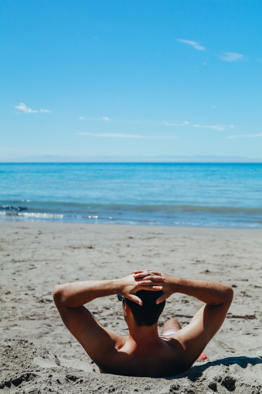 man leaning on beach in Santa Cruz United States