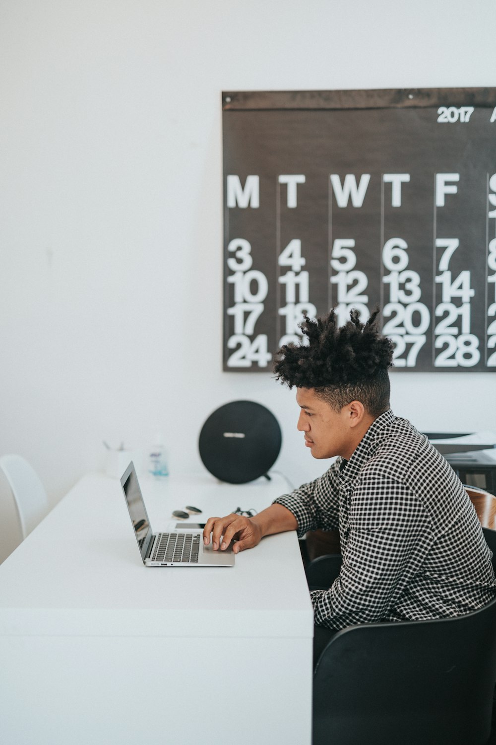 man playing laptop