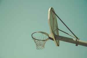low angled photography of beige basketball hoop