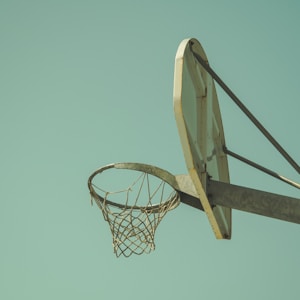 low angled photography of beige basketball hoop