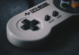 selective focus photography of SNES controller