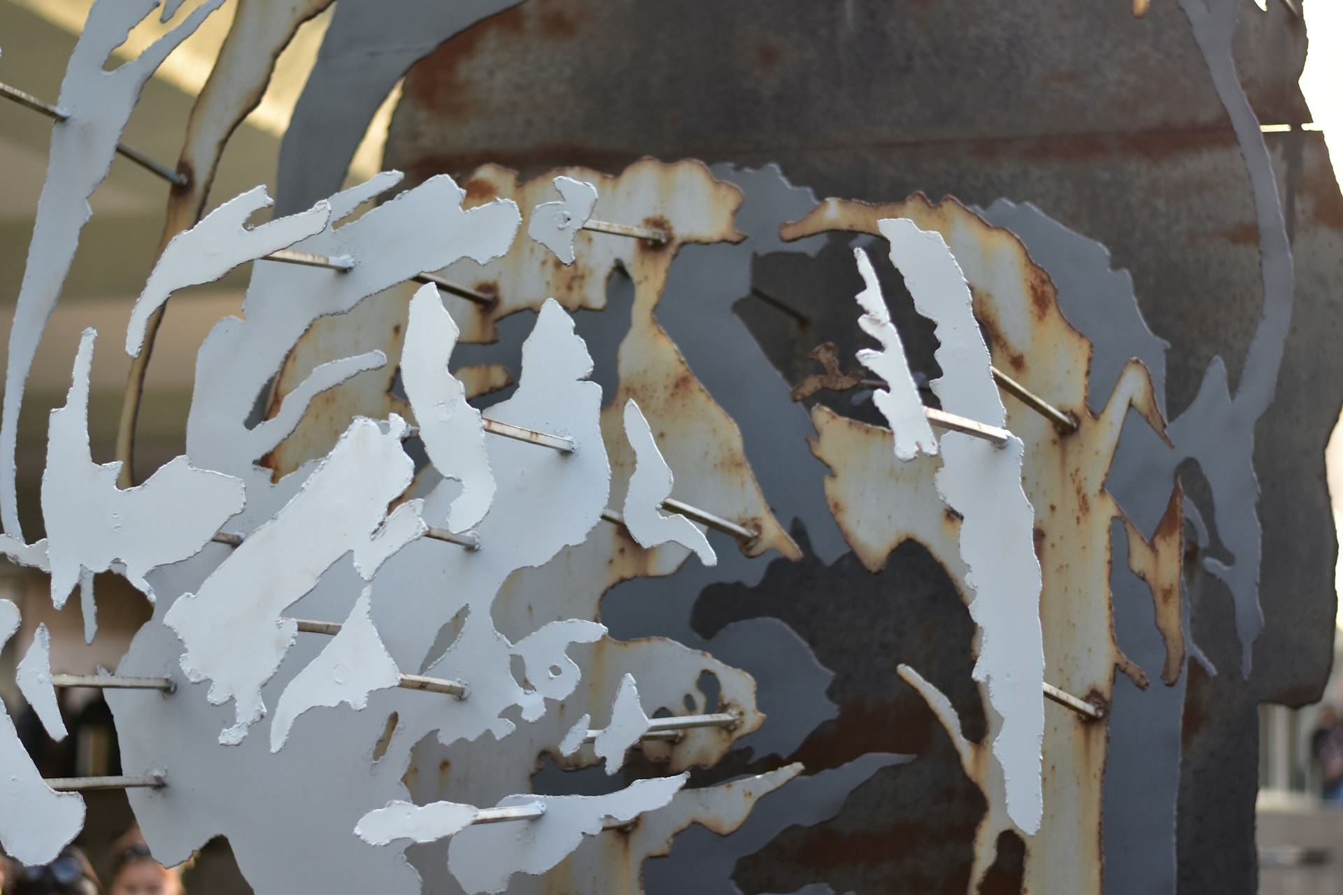 An intricate close-up of a metallic art piece blending urban style with delicate craftsmanship.