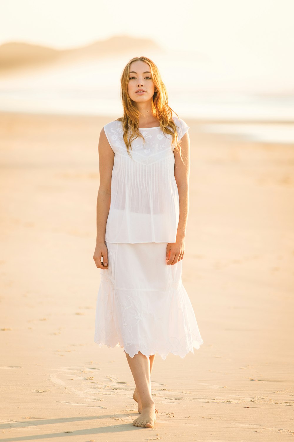 woman walking on the shore