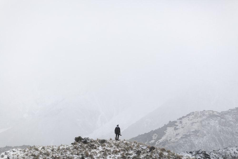 man standing on hill