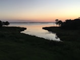 A tranquil water scene reflecting the sky at dusk.