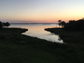 A peaceful lakeside scene at sunset reflecting tranquility and balance.