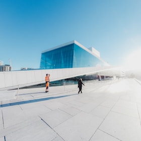 person walking on concrete road during day time