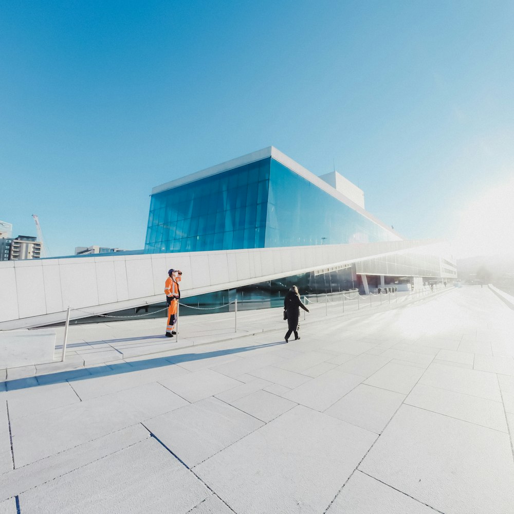 person walking on concrete road during day time