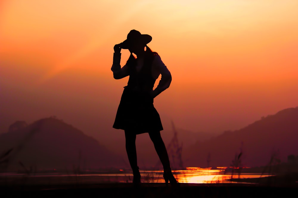 silhouette of woman during sunset