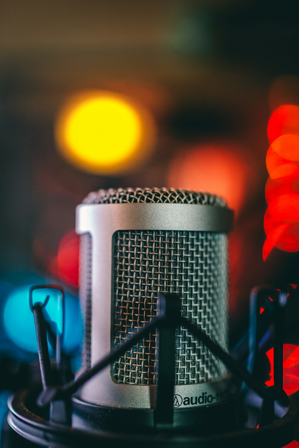 selective focus photography of condenser microphone