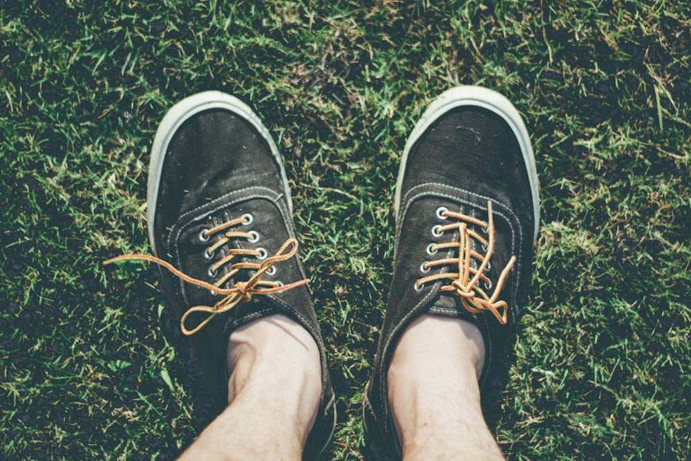 pair of black low-top sneakers