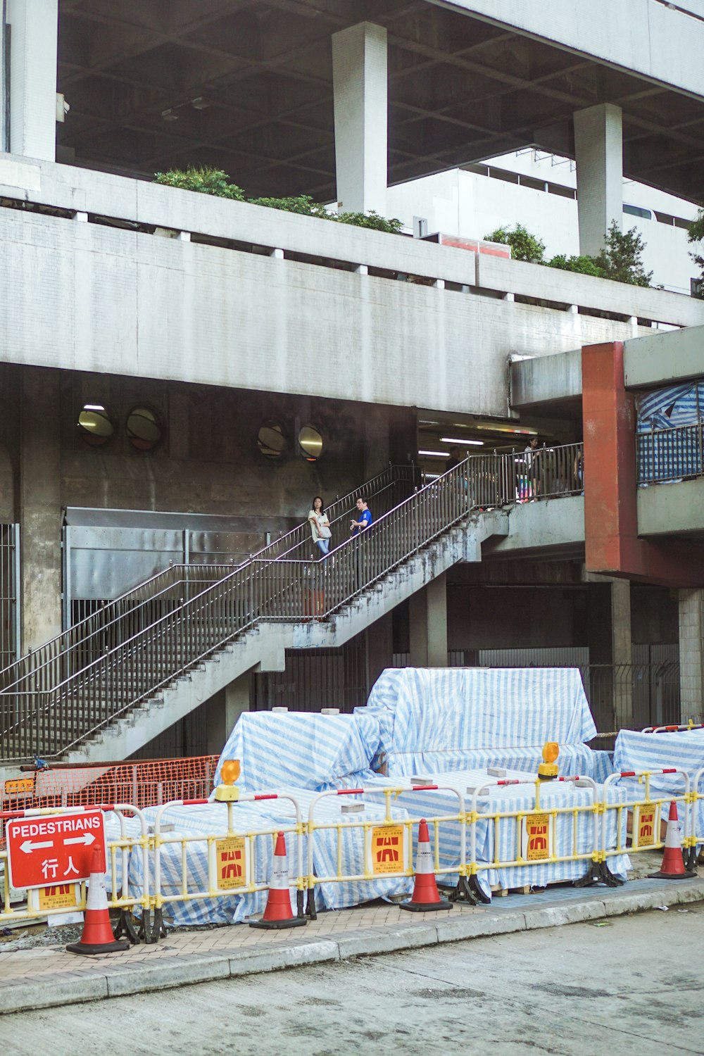 man and woman on building stairs