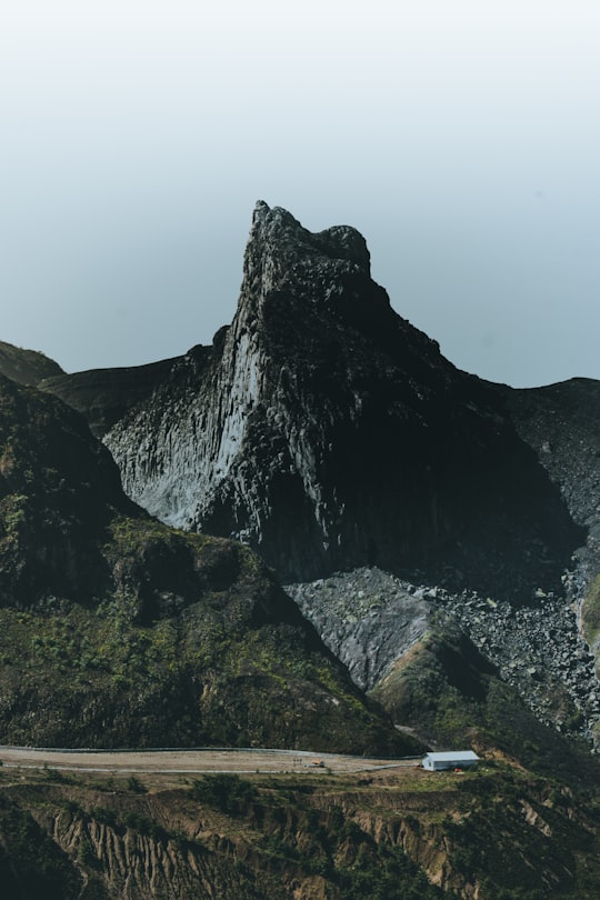 black and brown rock formation under white sky in Gunung Kelud Indonesia