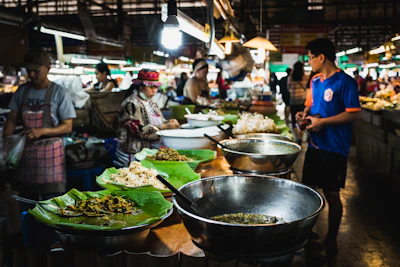 Close-up of a delicious local dish being enjoyed at a bustling market.