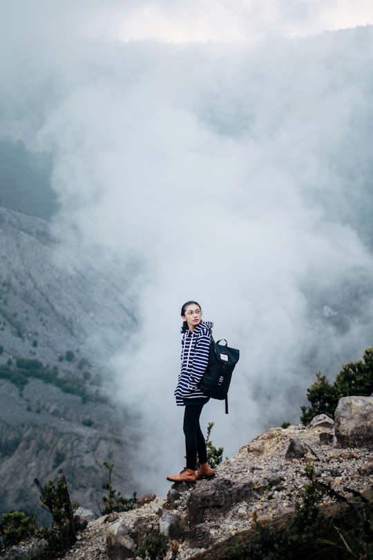 woman looking backward in Tangkuban Perahu Indonesia