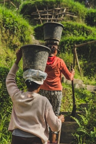 woman with buckets on heads