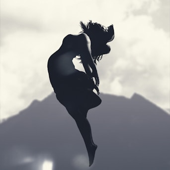 silhouette of person jumping in mid-air during daytime