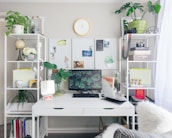 An organized home office with plants and stationery, representing productivity and clarity.