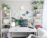 A serene home office setup with soft natural light and calming plants, perfect for a Zoom hypnotherapy session.