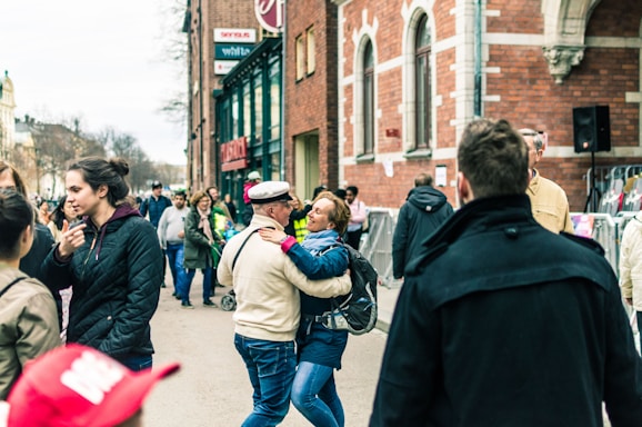 A vibrant street scene with diverse community members engaging warmly, symbolizing connection and collaboration.