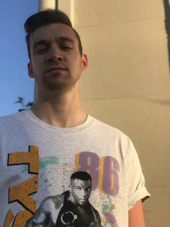 Model wearing a comfortable grey boxer and a matching simple t-shirt in natural light.