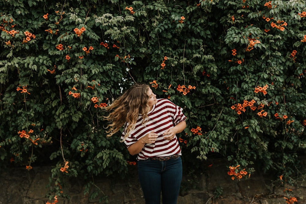 woman standing and waving her hair