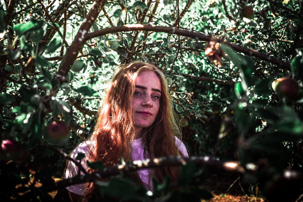 woman in the middle of plants