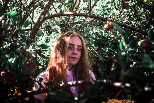 woman in the middle of plants in Ordrup Denmark