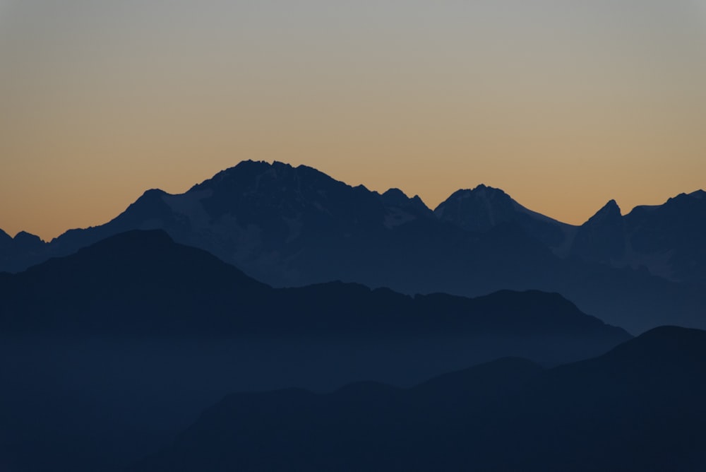 silhouette of mountain during sunset