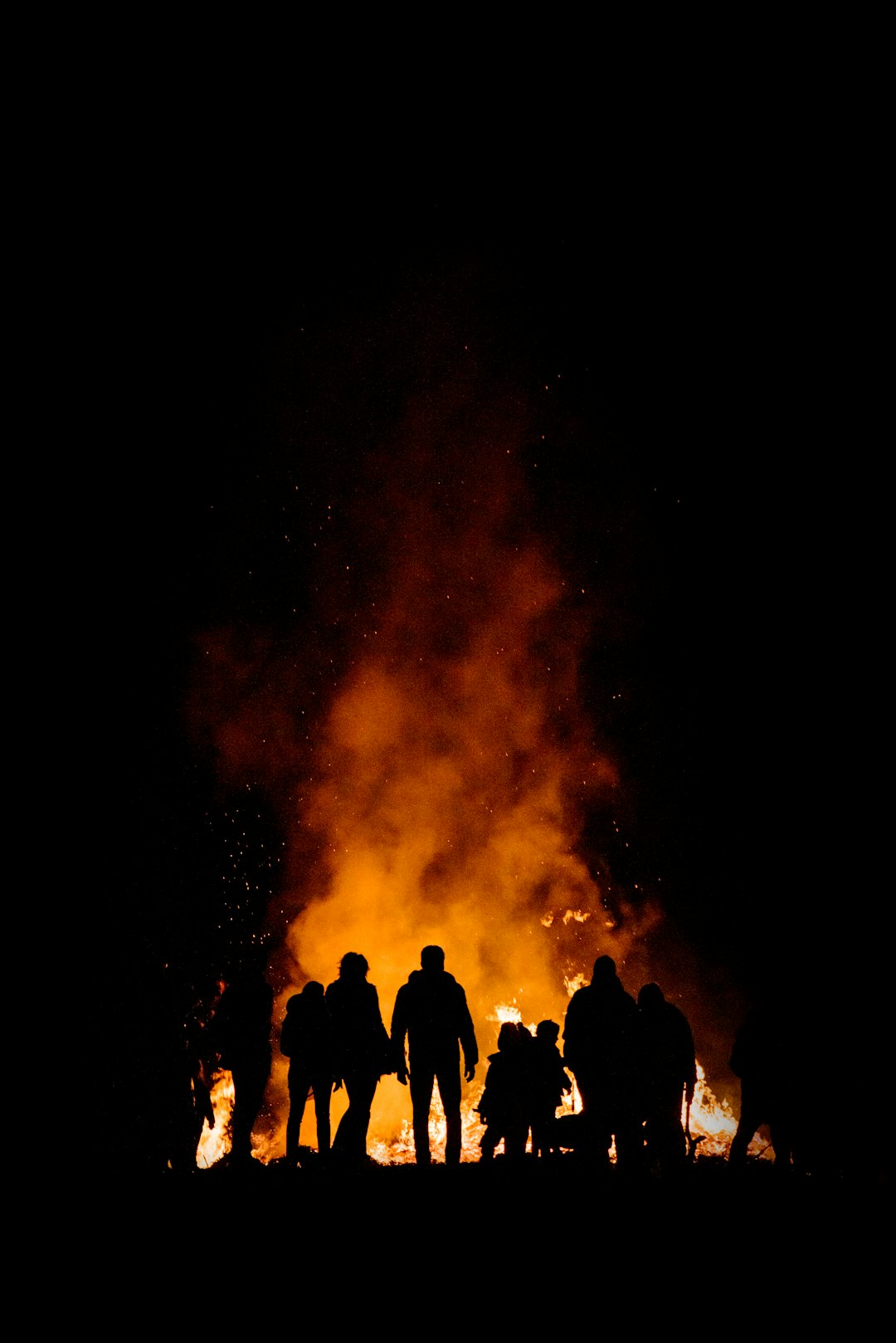 bonfire surrounded by people