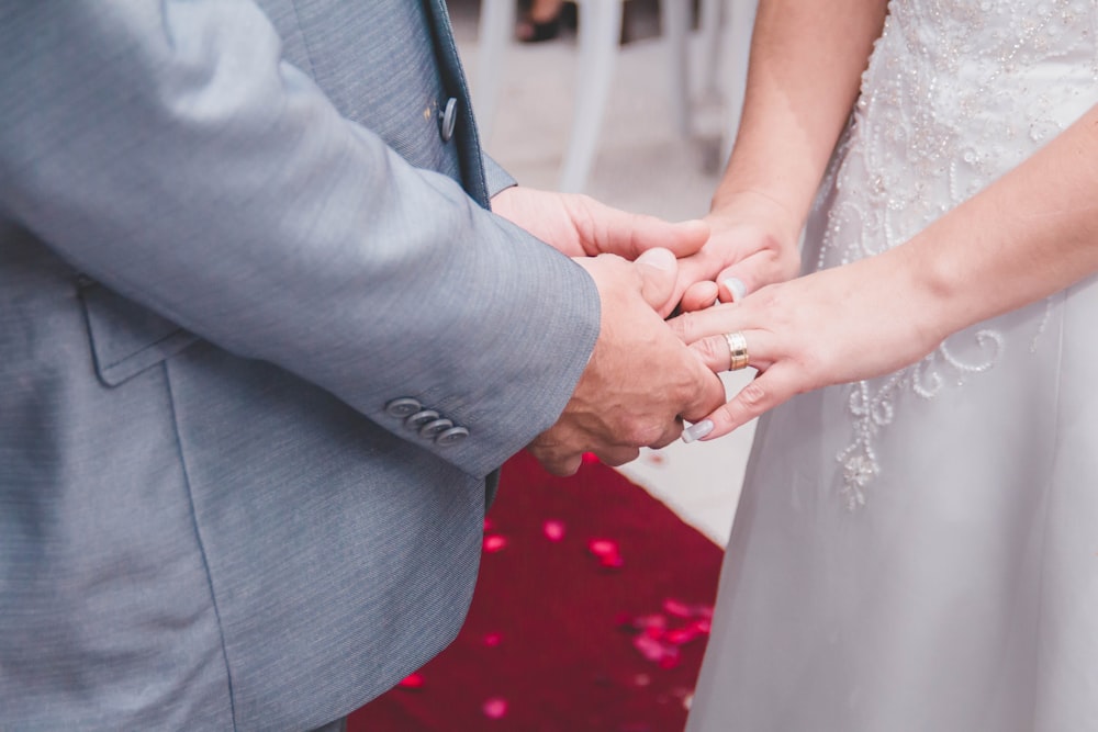 man holding woman's hands