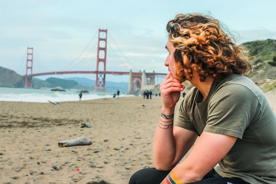 man in gray T-shirt near Golden Gate Bridge in Golden Gate Bridge United States