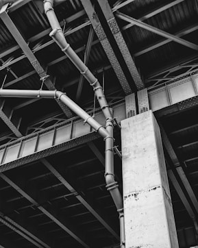 grayscale photo of building post