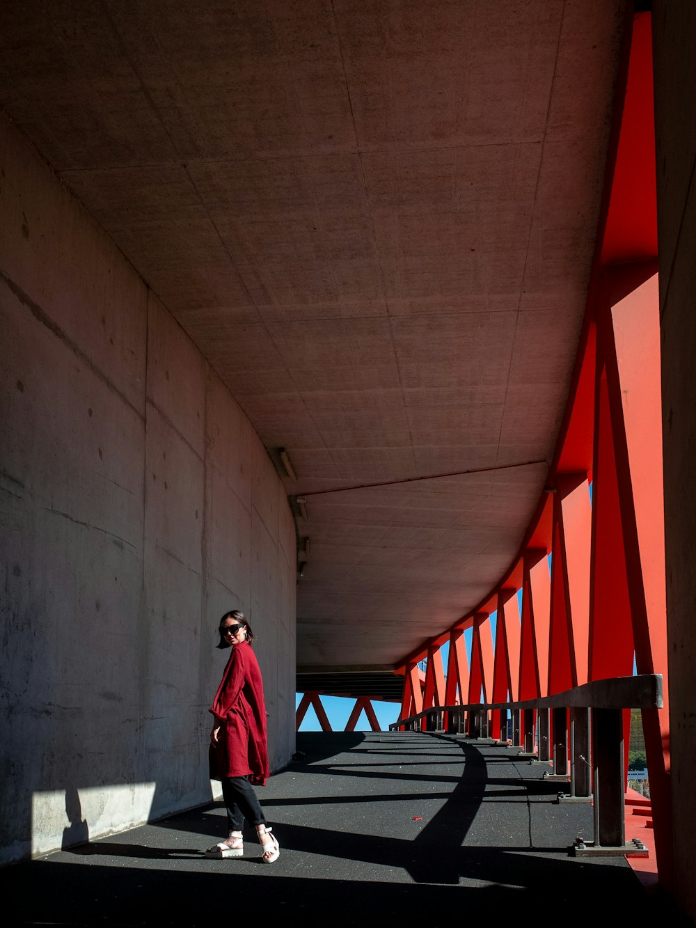 woman standing near gray wall