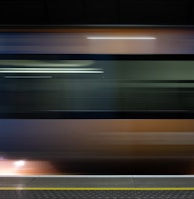 a blurry photo of a train passing by