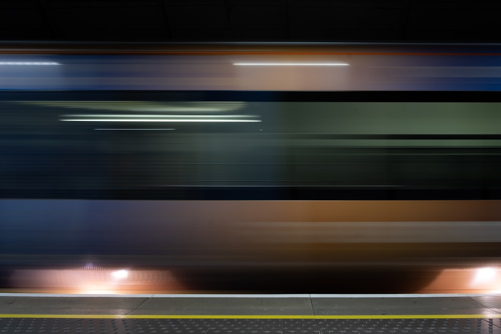 a blurry photo of a train passing by