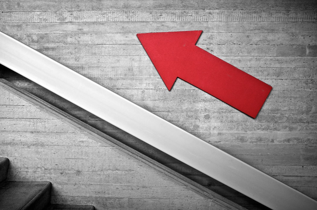 two steps ahead two steps ahead red arrow going up a stair case