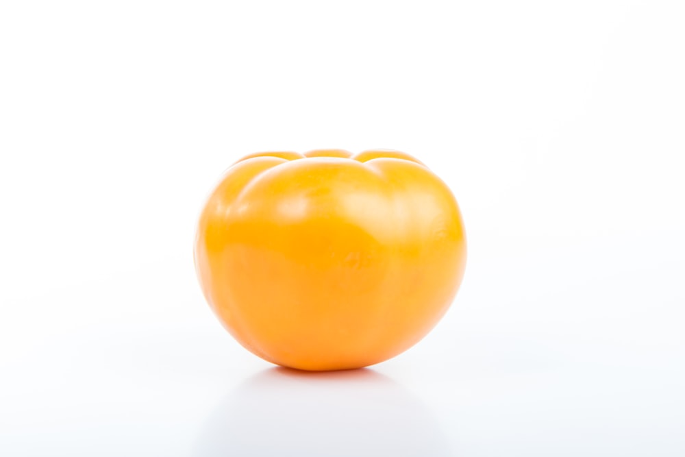 tomato on top of white surface
