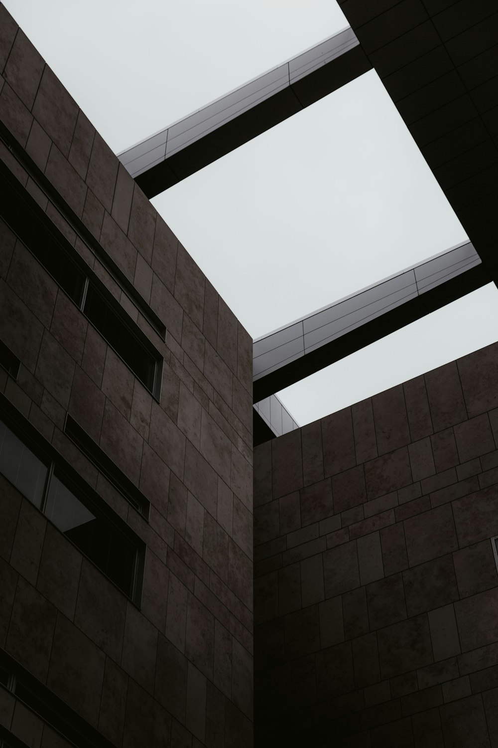 low angle photography of brown concrete building