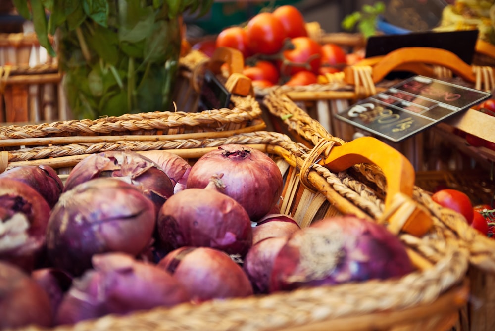 selective focus photography of onions in basket