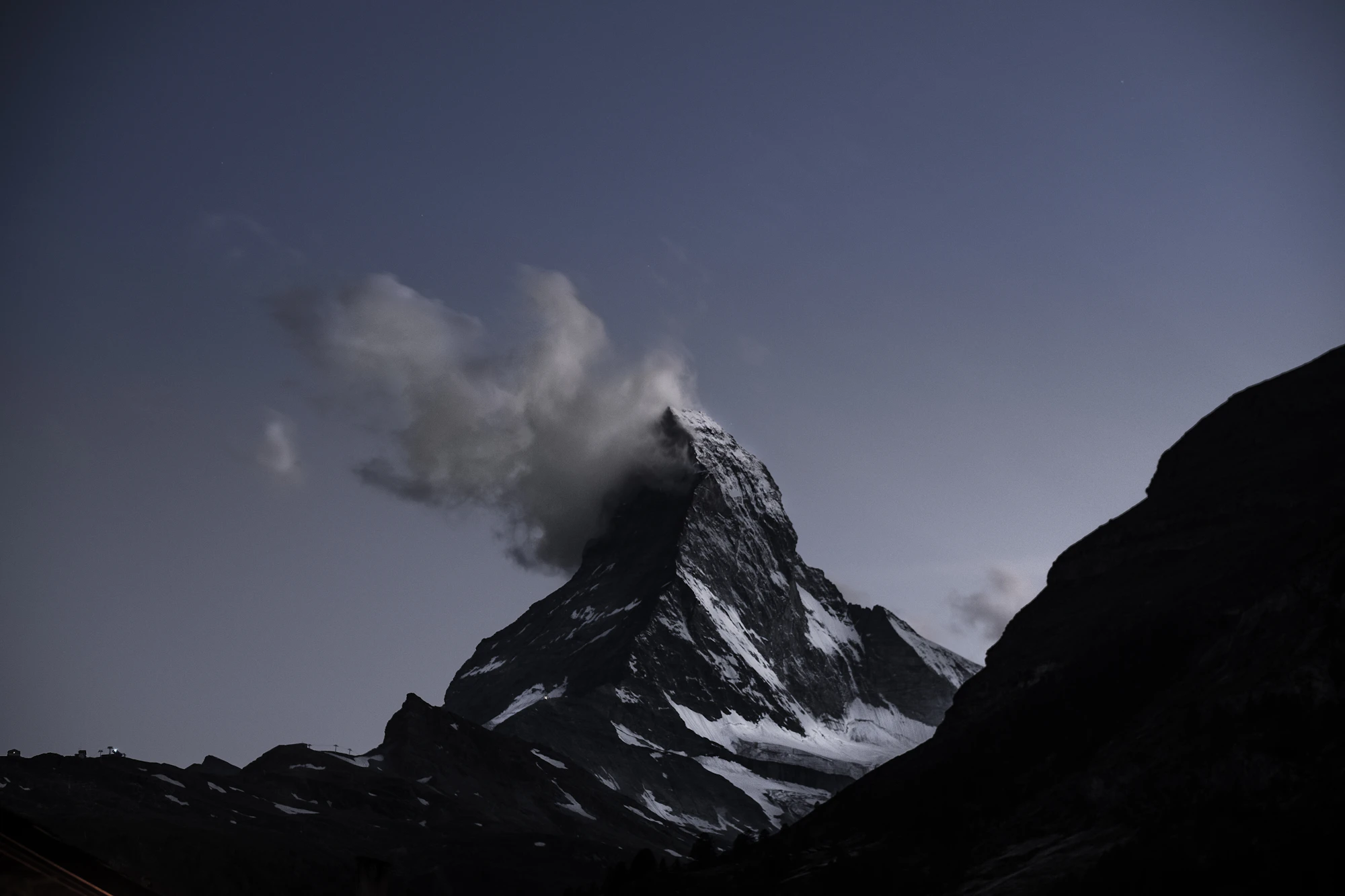 Alpine mountain range at dawn, symbolic of long-term perspective and permanence.