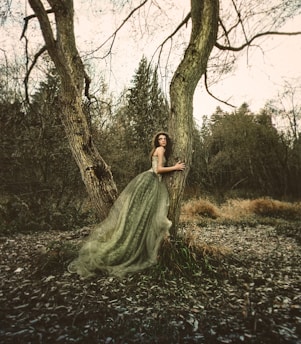 sepia photography of woman wearing princess dress hugging truck